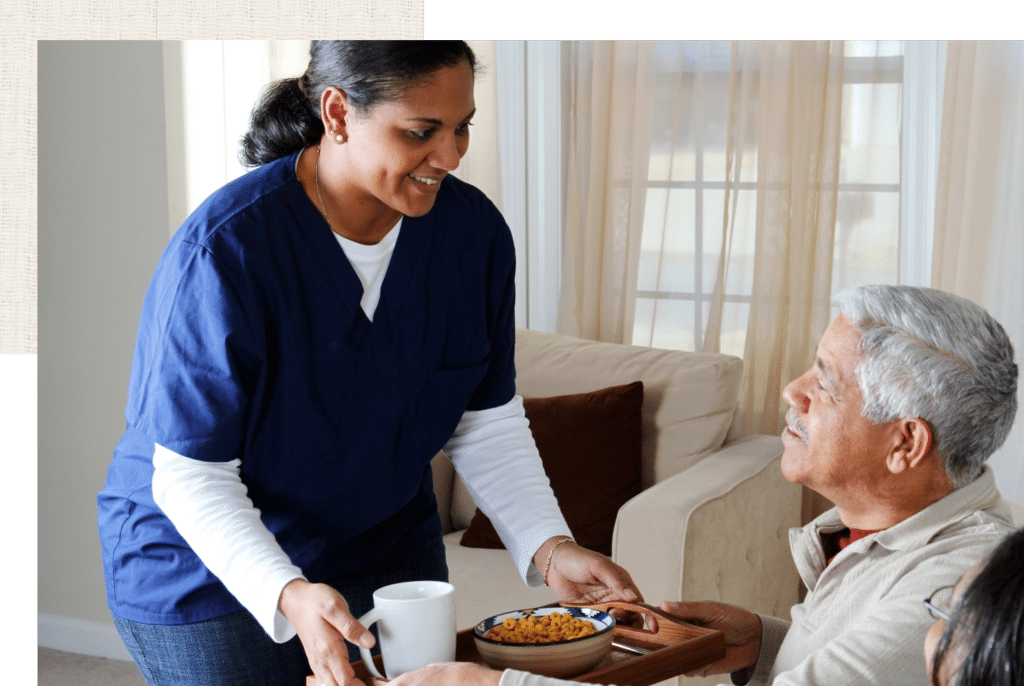Caregiver Serving Food to Patient
